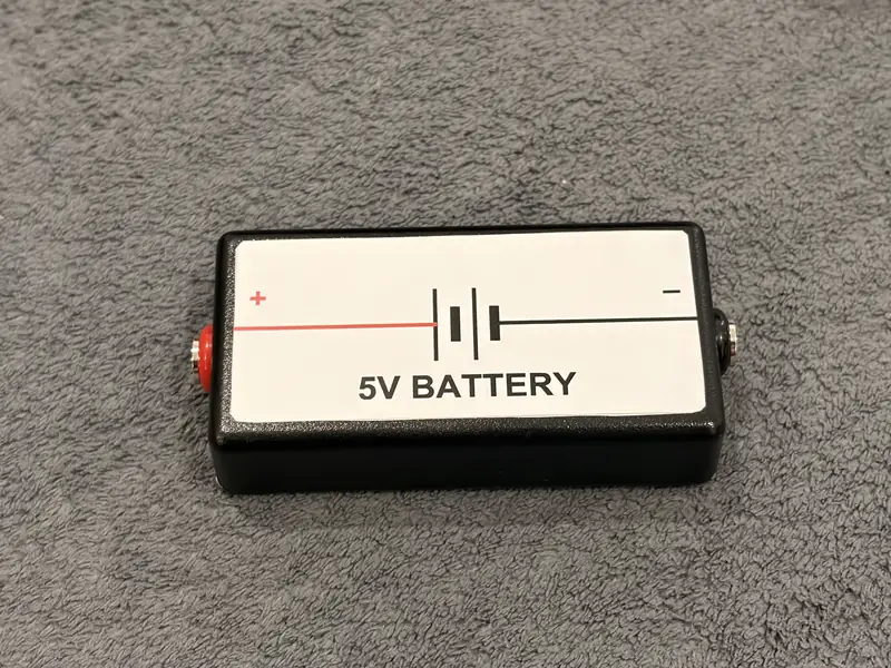 BushieBoy 5V battery module with circuit symbol label